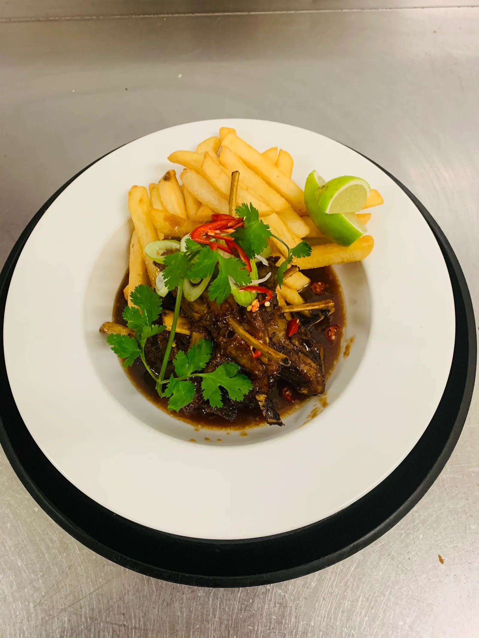 Braised lamb ribs with chips, chilli and lime