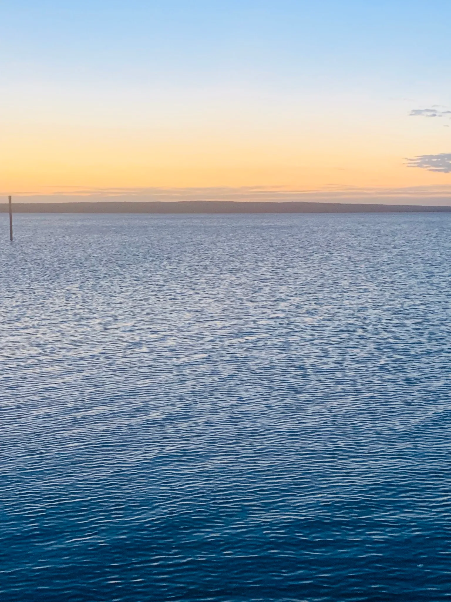 Calm bay at sunset near Lang Lang